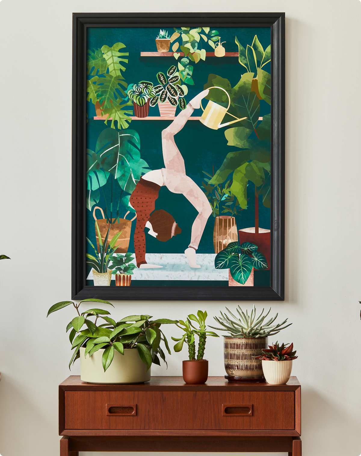 Artwork of an upside-down figure among lush green houseplants against a dark teal backdrop